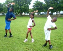 Mustangs Ira Phillips, Mikaela Smith and Valence Modeste stretch after practice at UVI. Mustangs Ira Phillips, Mikaela Smith and Valence Modeste stretch after practice at UVI.